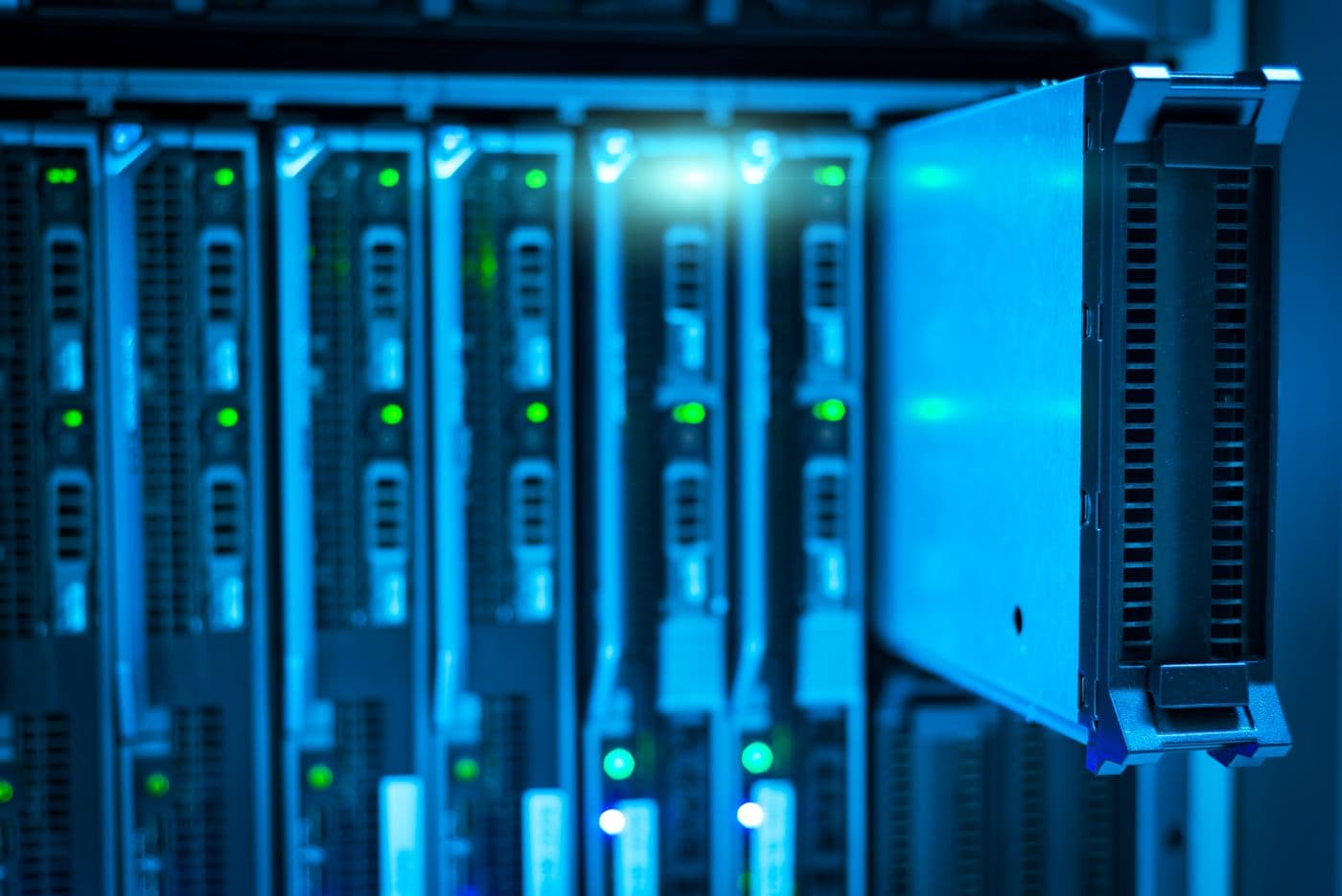 Close-up of servers with blue indicator lights in a data centre