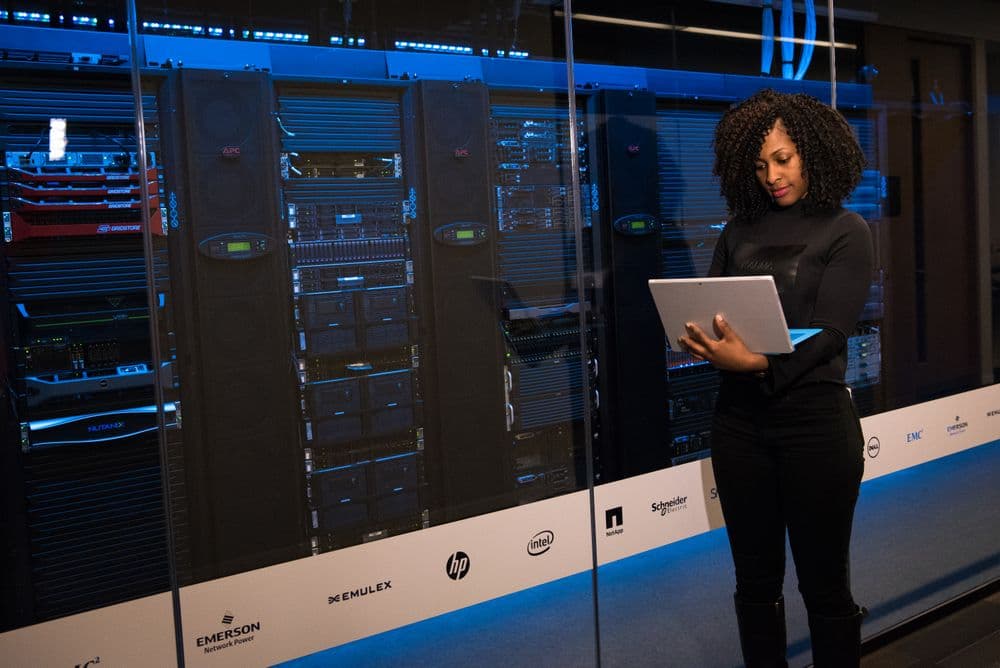An engineer checking servers in a data centre